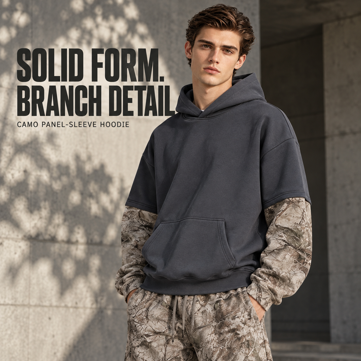 A36552 Dark Grey layered camo-sleeve fleece hoodie, front styling view