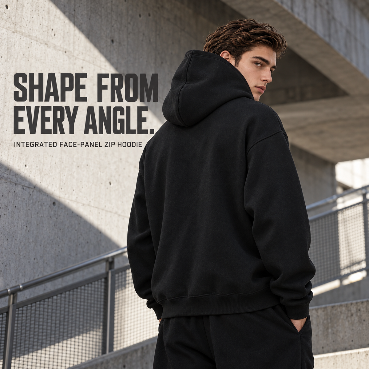 A63552 Black two-way zip hoodie with concealed face panel, rear or three-quarter styling view